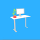 A standing desk with a pot plant on it